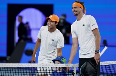 Learner Tien and Alexander Zverev pose for a photo before their quarter final match.