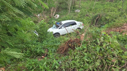 A damaged car in a field