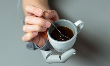 Robotic thumb holding java cup