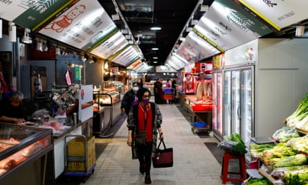 People shop at a market in Taipei last month.