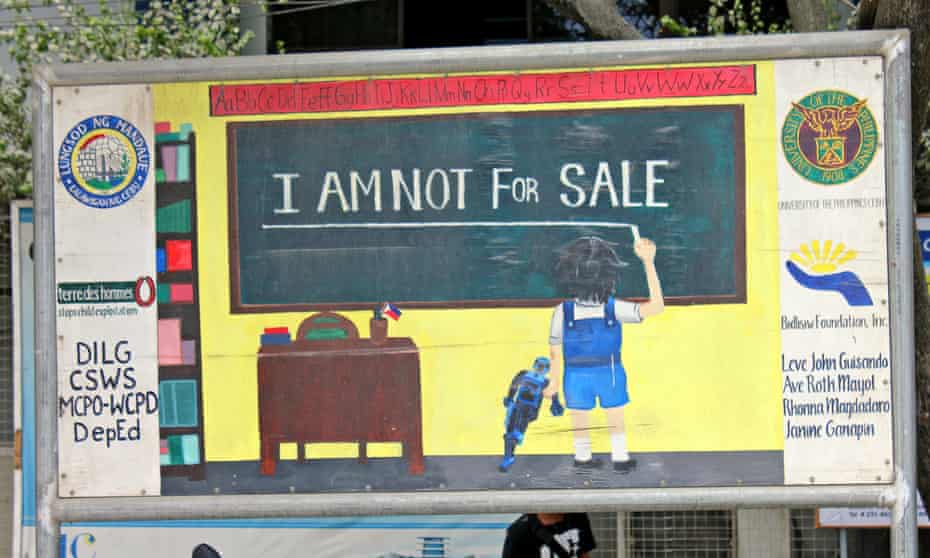 An anti-child abuse sign outside a school in the Philippines