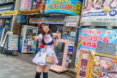 A young Japanese woman dressed as a maid to promote the cafes of Akihabara.