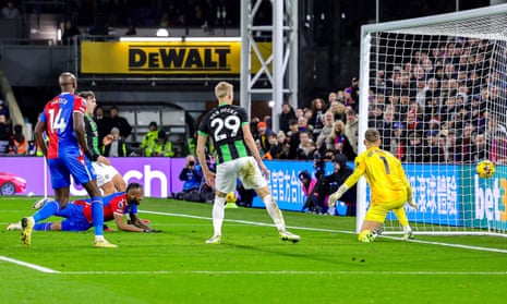 Jordan Ayew (on the floor) heads the ball to give Crystal Palace the lead.