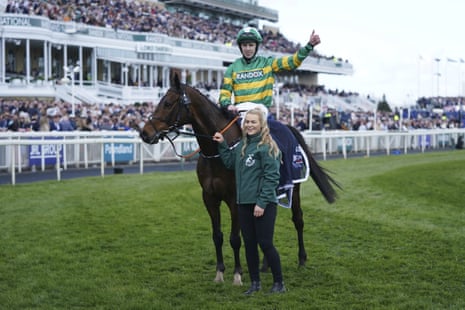 M P Walsh celebrates on board Sire Du Berlais after winning the Aintree Liverpool Hurdle.