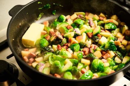 Pan of brussels sprouts, butter, kaiserfleisch, apple and juniper berries.