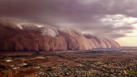 An enormous dust cloud over a flat landscape in Australia