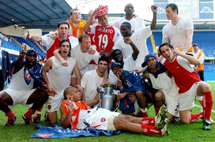 Arsenal’s ‘Invincibles’, including Sol Campbell (left) celebrate after clinching the 2004 title at Tottenham.