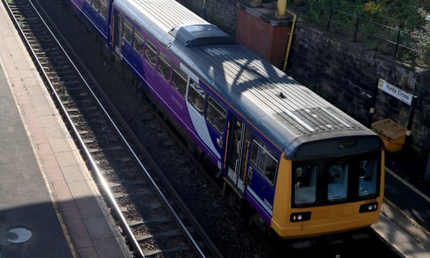A Northern Pacer train travels through Hunts Cross station in Liverpool. 