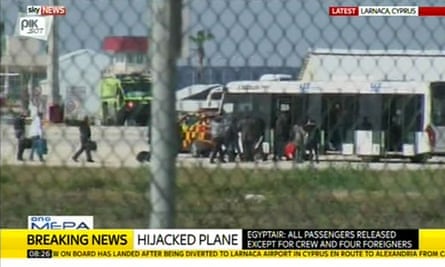 Passengers leave the hijacked plane at Larnaca airport