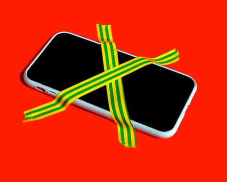 Colorful still life of a banned smartphone with cross-hatched adhesive tape symbolizing digital detox and mindfulness