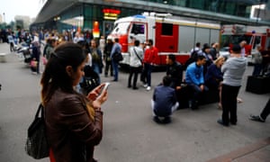 People wait on the street in Moscow