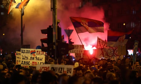 People wave flags and light up flares during a protest over the collapse of a concrete canopy that killed 15 people in Novi Sad, Serbia.
