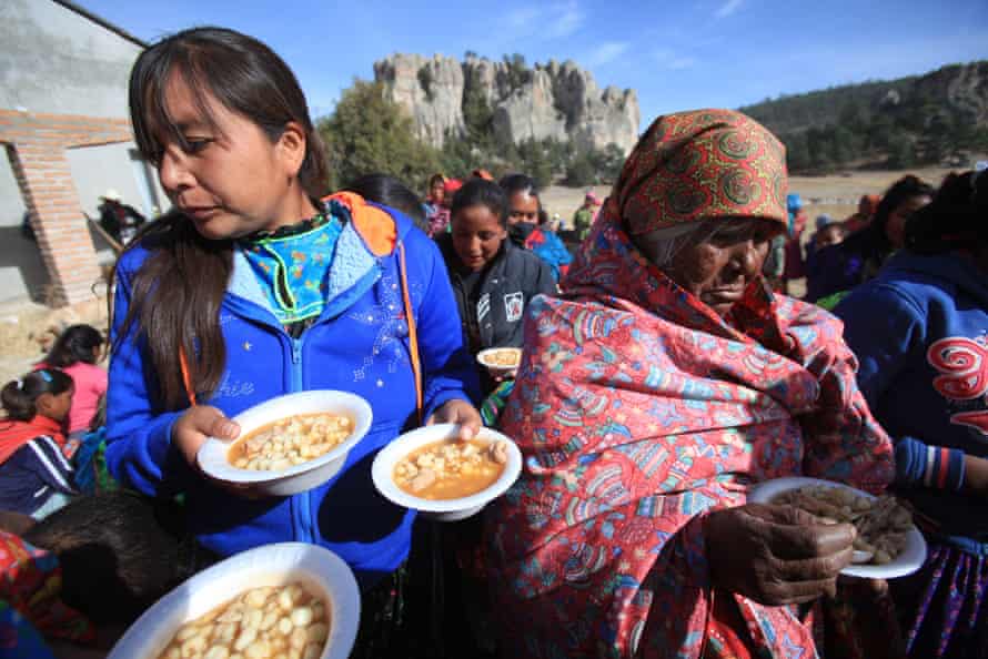 Indigenous Rarámuri people receive food in Chihuahua state.