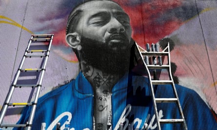 A mural commemorates the musician Nipsey Hussle outside of his Marathon Clothing store in Los Angeles, California.
