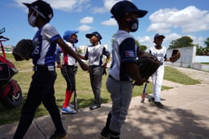 Children chat before baseball practice in Havana, Cuba