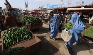 Women shopping at a market in Herat, Afghanistan.