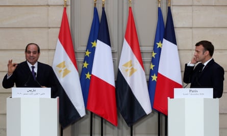 President Abdel Fatah al-Sisi, left, gives a join press conference with his French counterpart, Emmanuel Macron, in Paris on 07 December 2020.