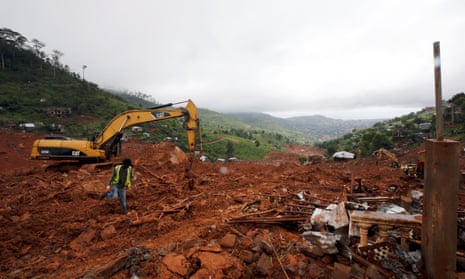 Heavy machines are seen during work at the place of the mudslide in the mountain town of Regent, Sierra Leone August 16, 2017. REUTERS/Afolabi Sotunde