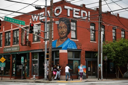 A “We voted!” mural in Atlanta, Georgia, features Stacey Abrams.