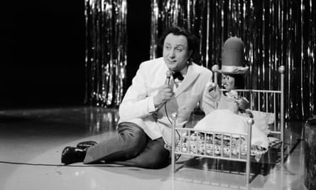 Ken Dodd sings with one of his Diddymen puppets on his TV show, circa 1968