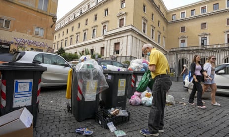 Rubbish spills from bins in Trastevere, a neighbourhood in central Rome, Italy.