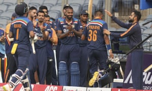 Teammates applaud Krunal Pandya as he walks off after scoring a fabulous half-century on debut.