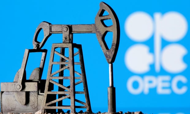A 3D-printed oil pump jack in front of the OPEC logo.