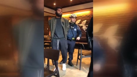 Social media video shows arrests of black men at Philadelphia Starbucks – video 