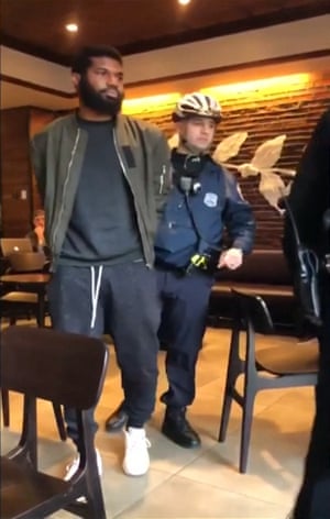 Video posted to social media shows police officers arresting Rashon Nelson and Donte Robinson (not pictured)