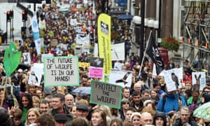 Demonstrators march in the People’s Walk for Wildlife in central London.
