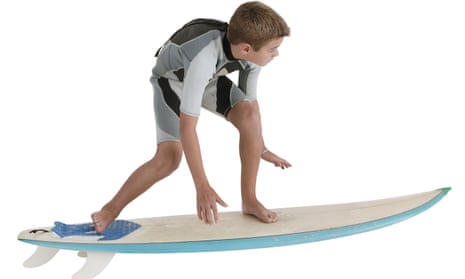 Boy riding a surfboard