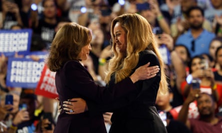 Musical artist Beyonce, right, and Democratic presidential nominee Vice President Kamala Harris, left, embrace on stage