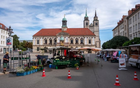 The market square in the centre of Magdeburg with civic buildings and market preparations