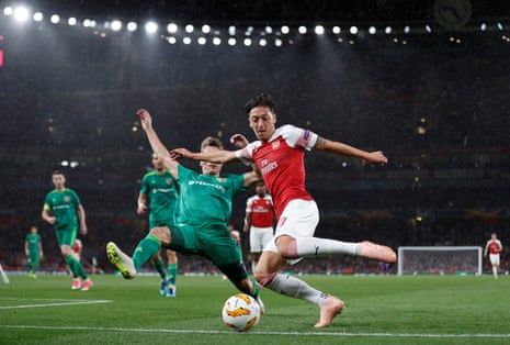 Ozil attempts to cut one into the area.