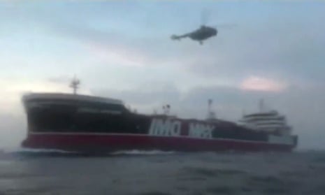 Helicopter hovering over a boat