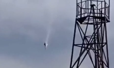 This video grab taken from the footage posted on a Wagner linked Telegram channel @grey_zone shows a plane falling in the sky near the village of Kuzhenkino, Tver region.