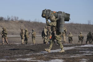Donetsk region, Ukraine: A serviceman carries an anti-tank weapon during an exercise