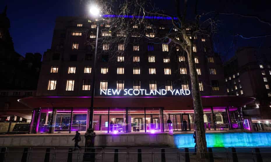 New Scotland Yard in central London, lit up in purple for Holocaust Memorial day