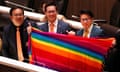 Thai lawmakers hold a rainbow textile