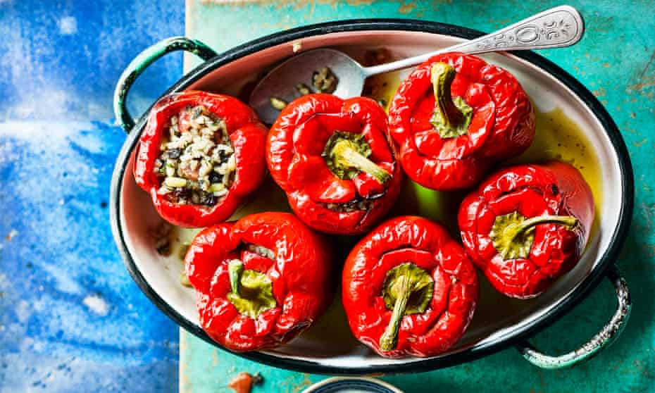 Bell peppers stuffed with rice, raisins and pine nuts.