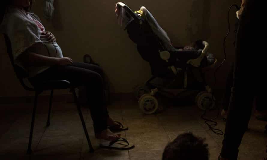 A pregnant 11-year-old sits during a hairdressing class in the Casa Rosa María children’s shelter.