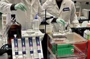 Shire Pharmaceuticals lab workers mixing buffers in the lab area.