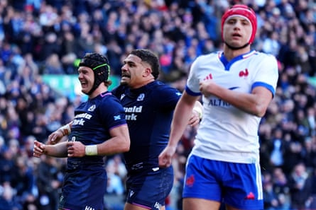 Scotland’s Darcy Graham (left) celebrates scoring a try with Sione Tuipulotu