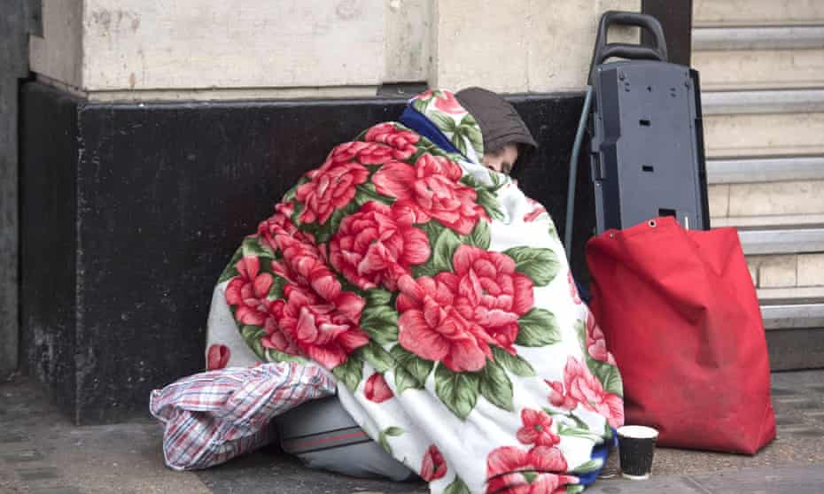 Homeless person under covers in London