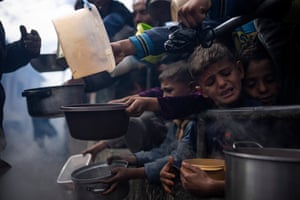Palestinians line up for food in Rafah
