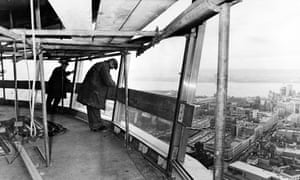 Work going ahead on the fitting of windows in the revolving restaurant on Radio City Tower