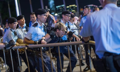 An activist is detained in recent protests in Hong Kong: the new law is alarming groups fearing a crackdown as Beijing exerts its control.