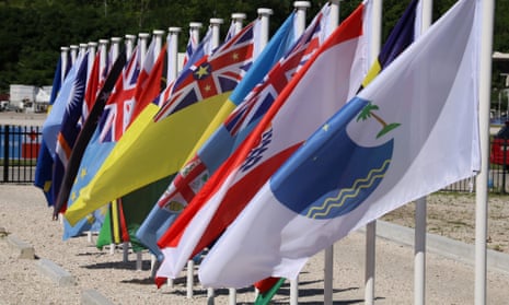 The flags of the nations of the Pacific Islands Forum, and of the forum itself. The forum has lost all of the Micronesian members - nearly one-third of the total - over a fractious selection for secretary-general. 