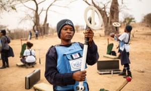 Loriana Tchulo Tavares Sacanombo prepares her equipment for mine clearing.