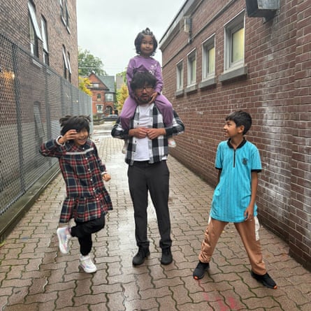 Idris with his three children in Canada